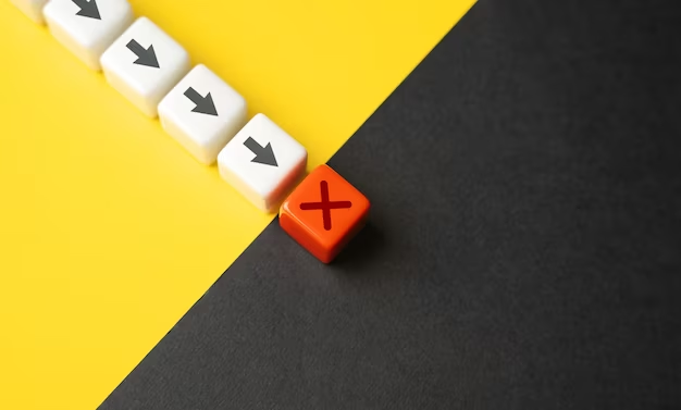 White and red dice with arrows on white side and a cross on the red side